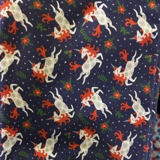 Camelot Holiday Unicorns fabric on navy with poinsettias, 100% cotton Christmas unicorn print