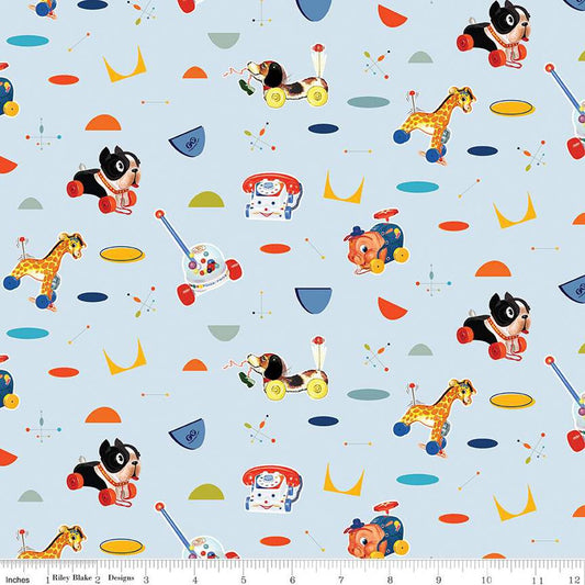 A fabric featuring colorful geometric designs and vintage Fisher-Price toy illustrations, such as a pull toy and stacking rings, on a blue background.