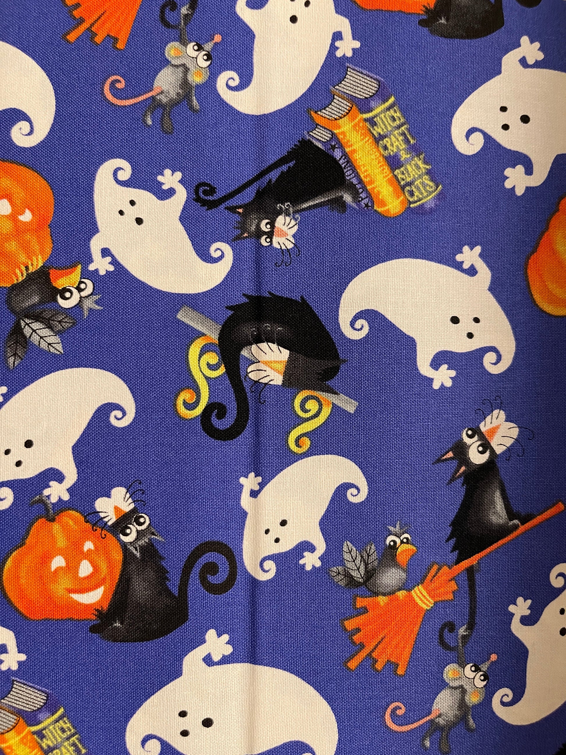 Henry Glass fabric Boo!  Ghosts, Cats and Jack-o-lanterns on purple Multi GLOW IN THE DARK Halloween Fabric