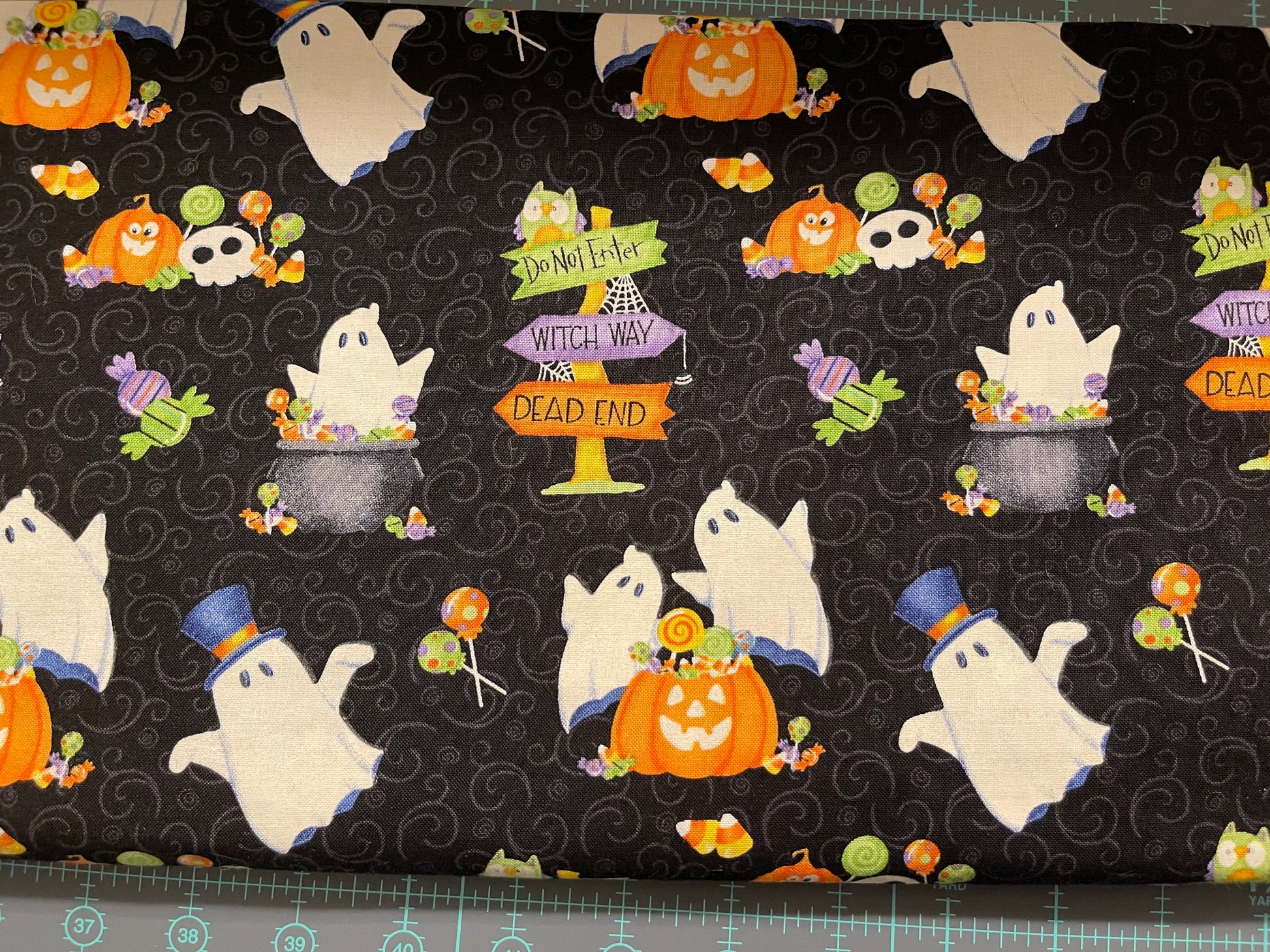 henry glass Fabric Glow Ghosts Collection Halloween Glow in the Dark Fabric with candy & ghosts